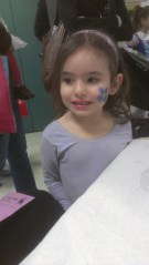 Lila with a Flower on her cheek.